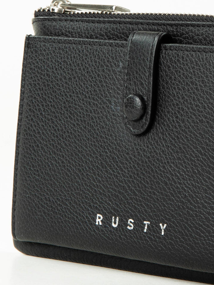 Rusty Grace Leather Pouch features RFID blocking & zip closure. 